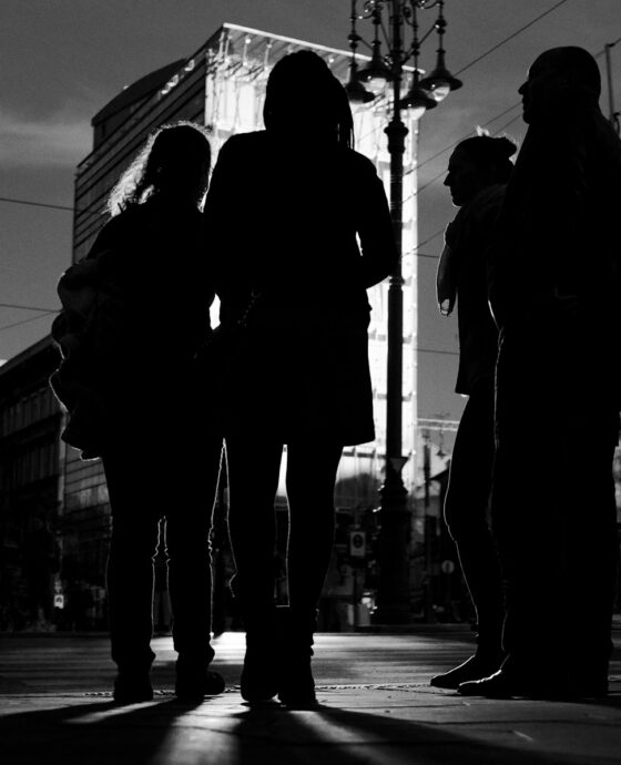 a group of people standing next to each other