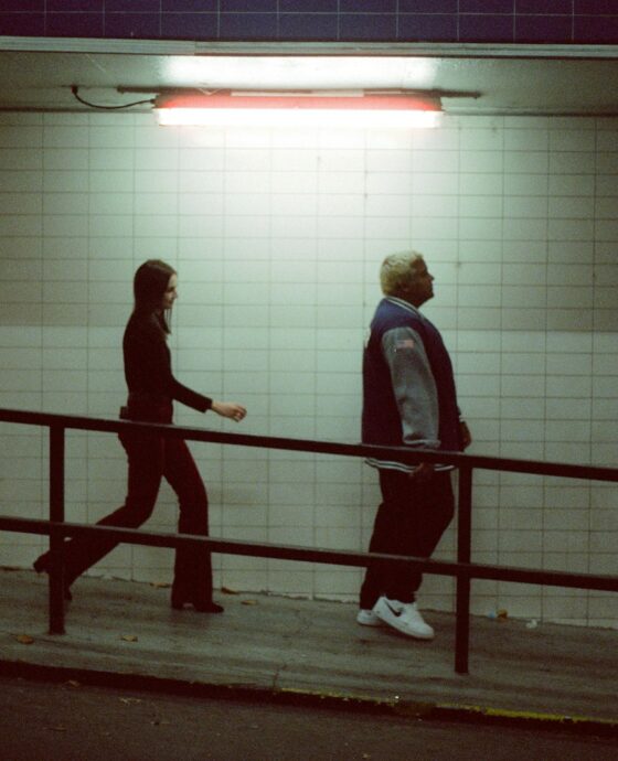 man and woman walking on basement