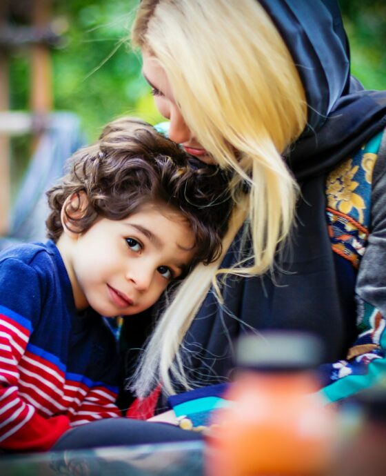 girl in blue red and black striped jacket