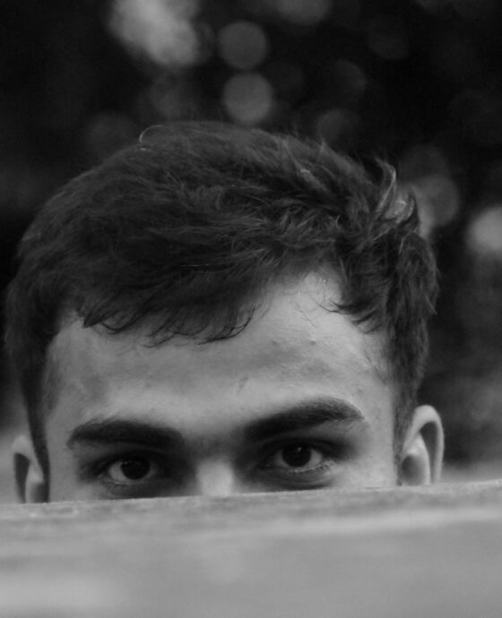 grayscale photo of mans face