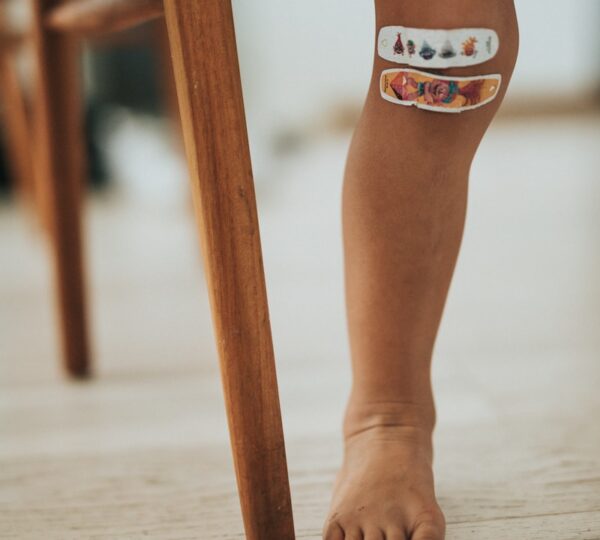 person wearing orange and white cat tattoo