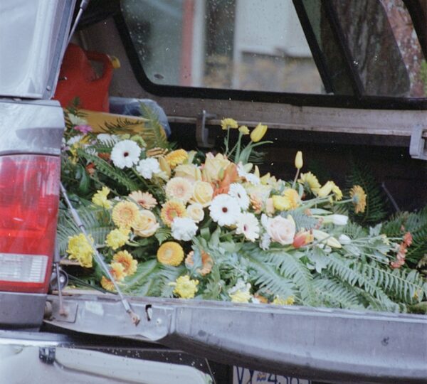 Flowers are loaded in the truck bed.